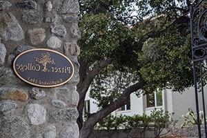 view of the pitzer gate and bronze plaque at the college's entrance